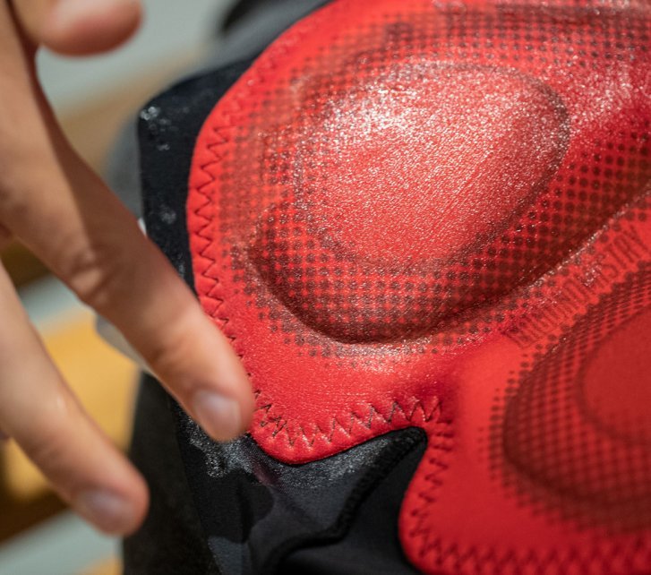 A close-up of the seat pad on Endura cycling shorts. The seams have been given a layer of Eule's chamois cream. There is a greasy film on the padding of the bib shorts.